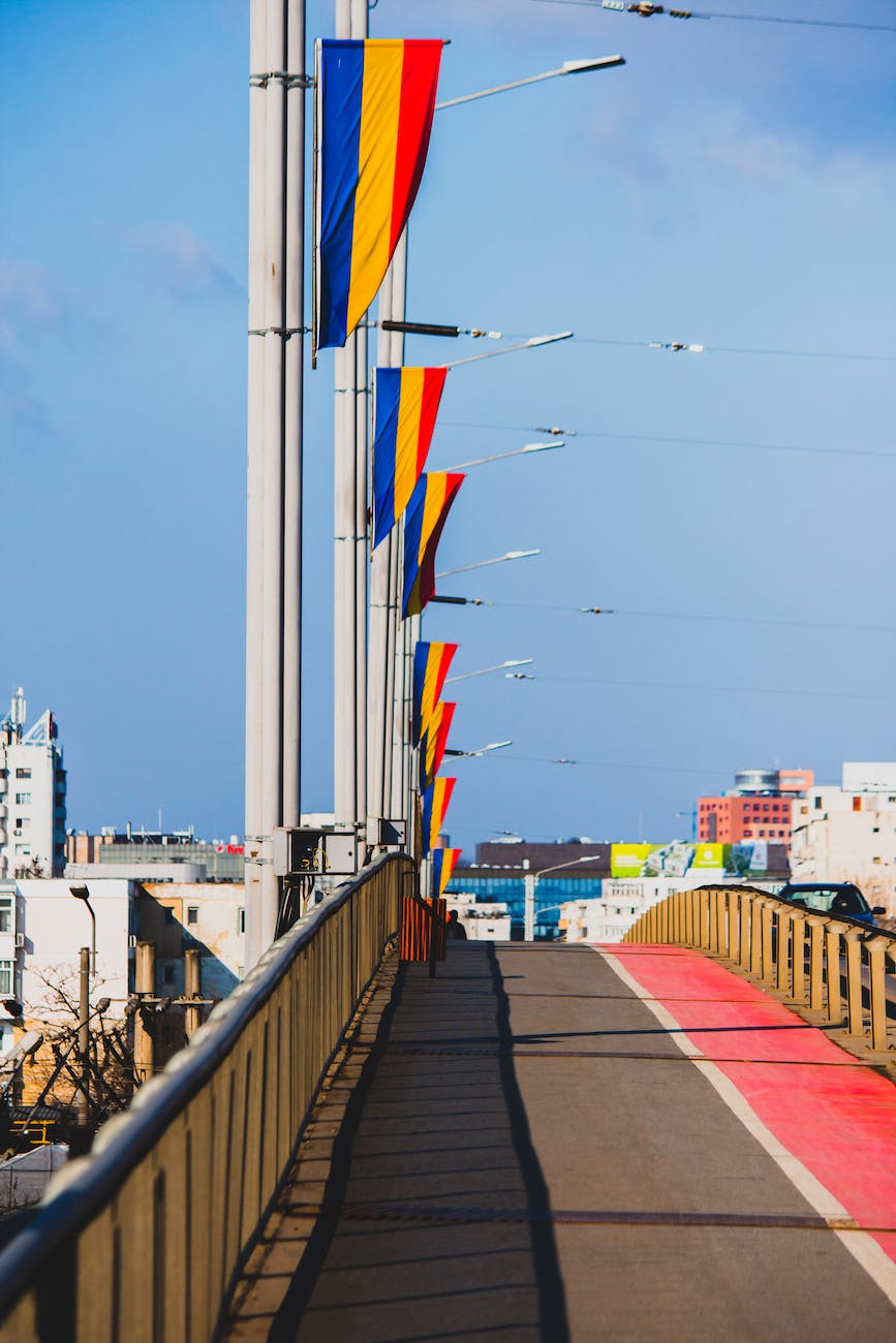 a bridge lined with romanian flags