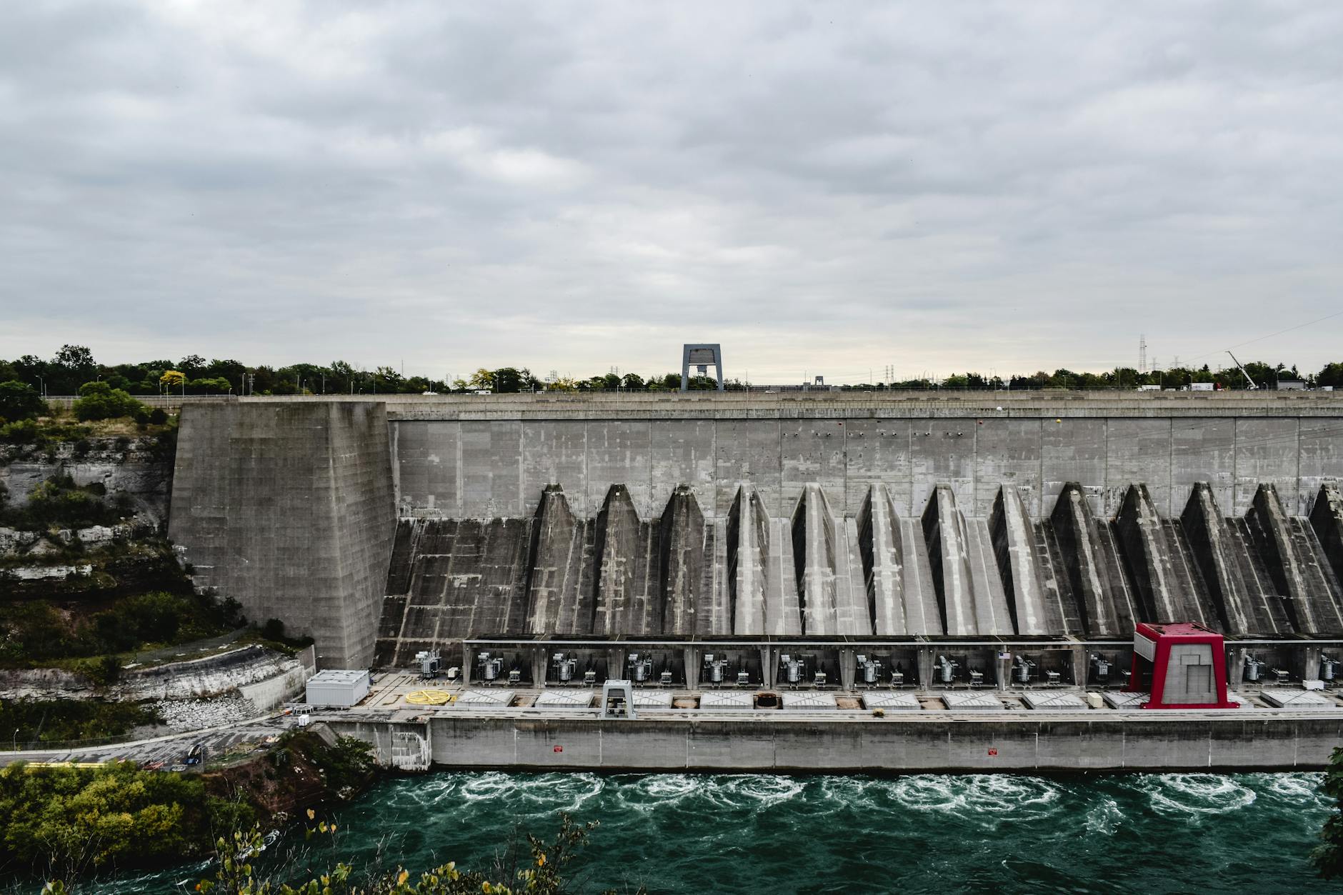 large concrete dam in birds eye view